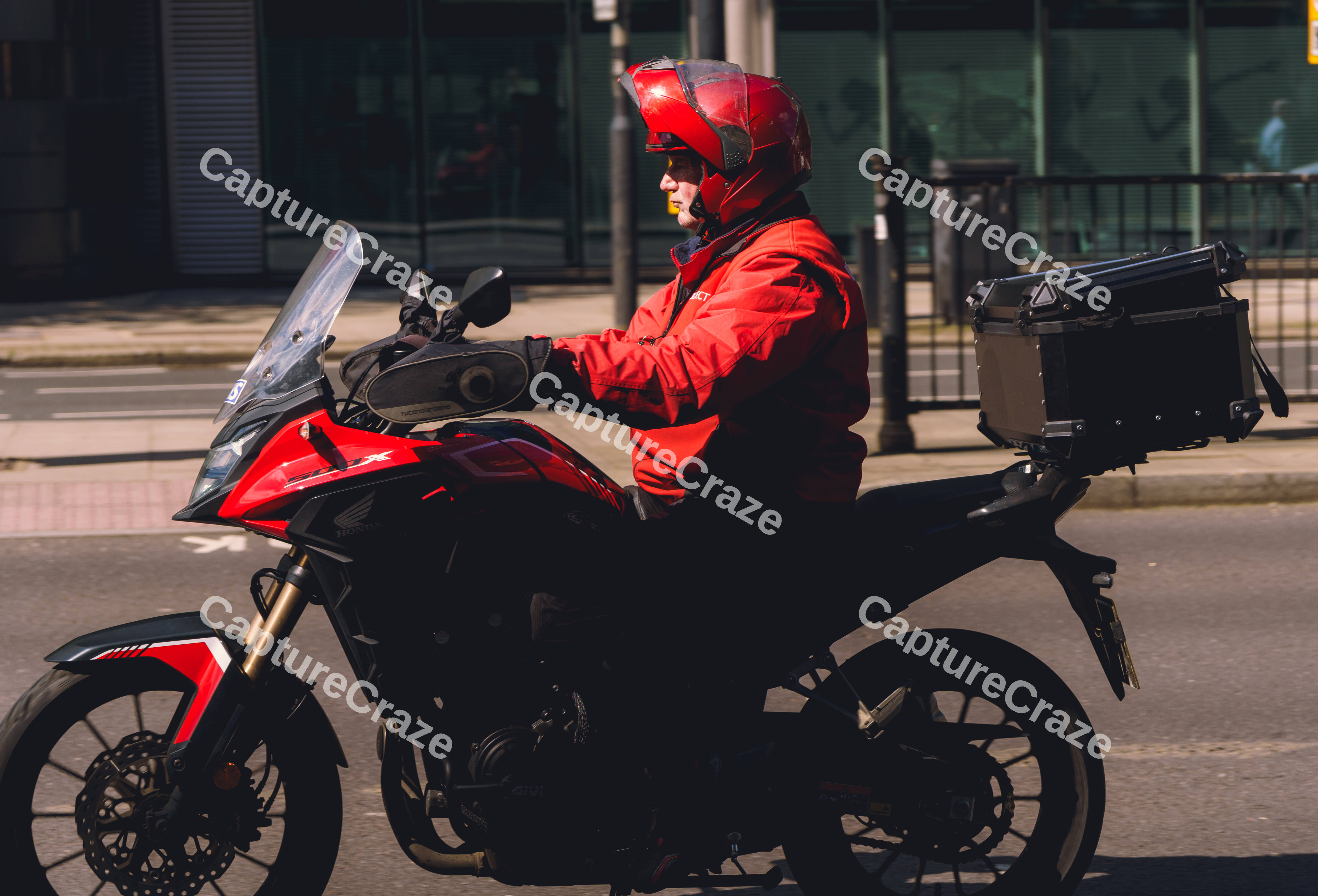 Man In Red On Motorcycle